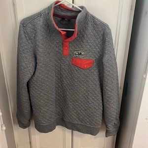 Gray Patagonia pullover with reddish orange details